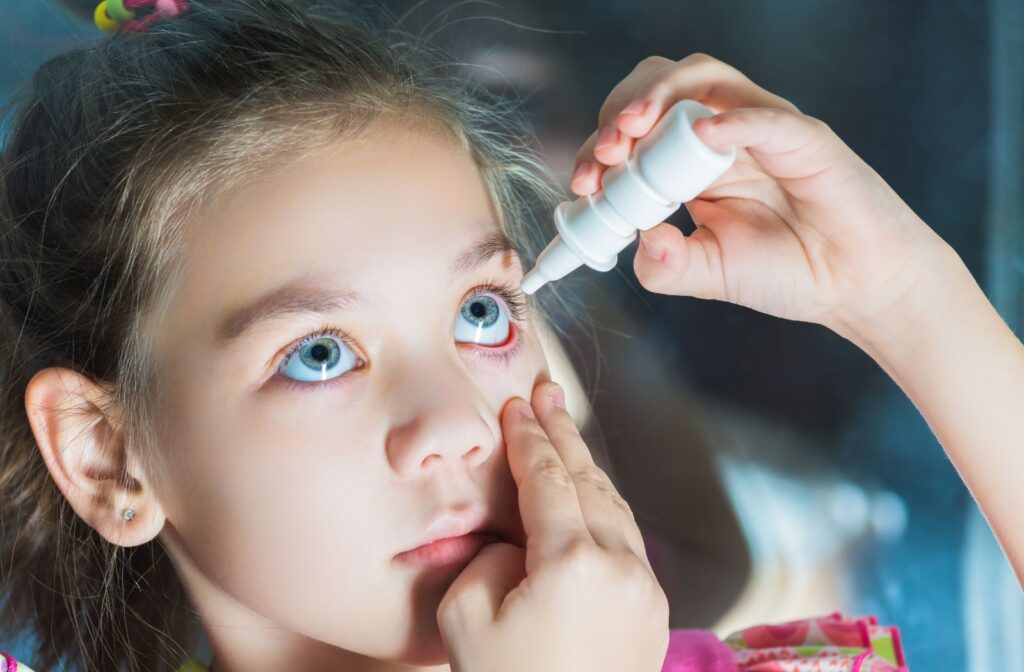 A young child using low-dose atropine drops for myopia management.