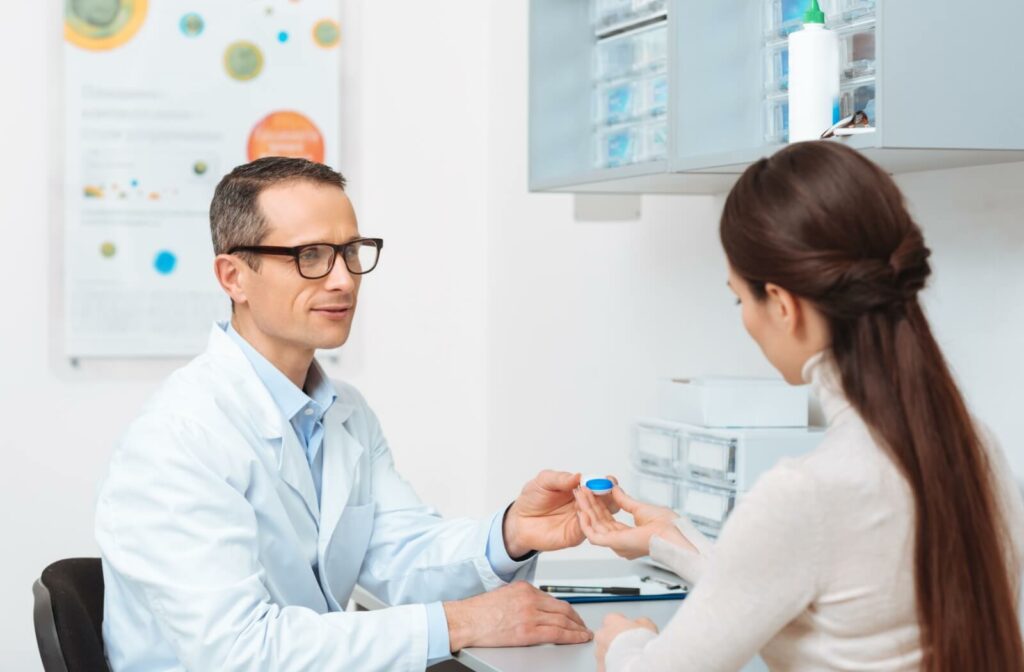 An optometrist recommends specific trial lenses to their patient during an annual contact lens exam and fitting.