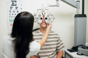 Patient receiving an eye exam from an optometrist.